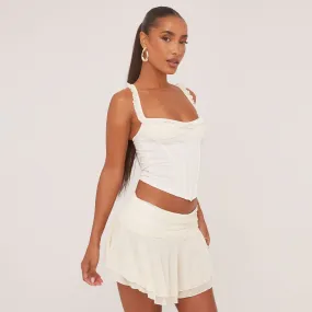 Frill Trim Corset Top And Flippy Hem Mini Skirt Co-Ord Set In Cream